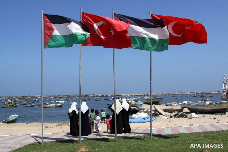 Palestinians gather in the port of Gaza during the end of the preparations to receive the Freedom flotilla "2" in Gaza city on June 28, 2011. Photo by Mohammed Asad