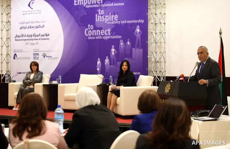 Palestinian Prime Minister, Salam Fayyad reports a speech at the opening of the annual forum for businesswomen, entitled 'Women and Entrepreneurship in the West Bank city of Ramallah on June 30, 2011. Photo by Mustafa Ab...