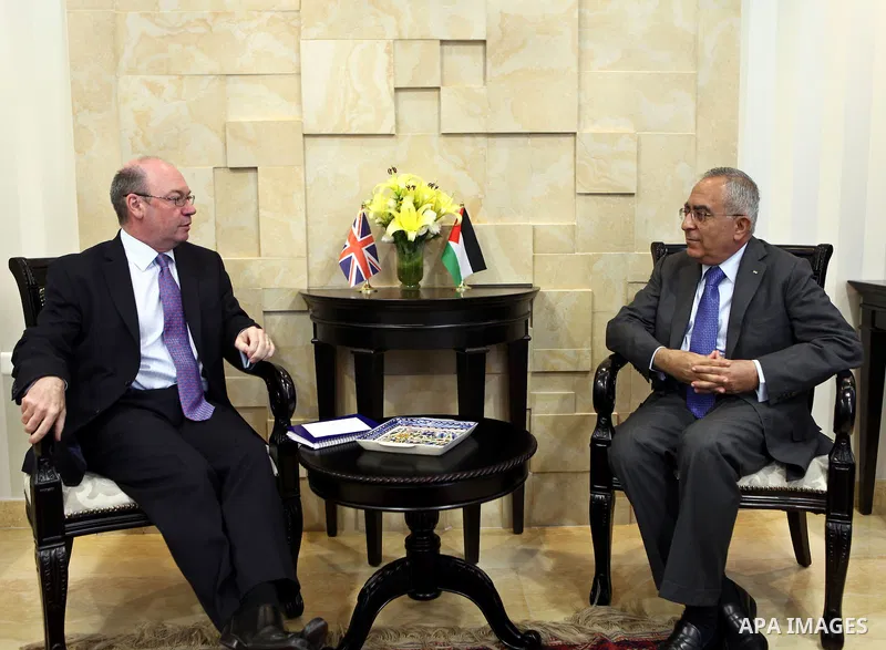 Palestinian Prime Minister, Salam Fayyad meets with Undersecretary of the Ministry of Foreign Affairs and Commonwealth Office in the United Kingdom, Alistair Burt in the West Bank city of Ramallah on June 30, 2011. Photo...