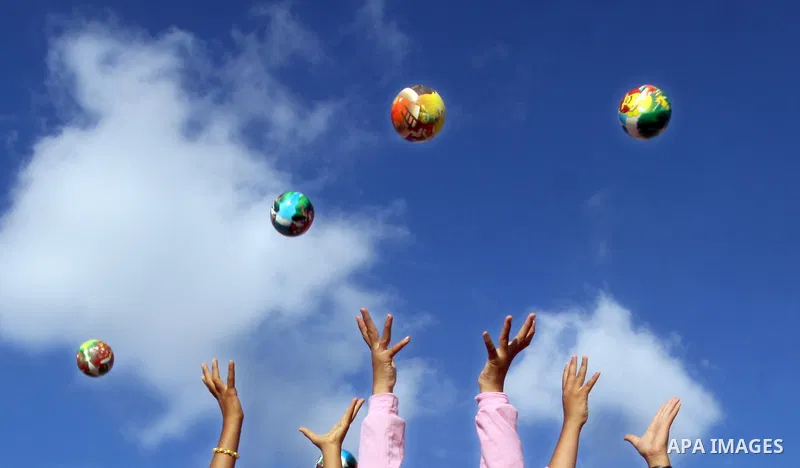 Palestinian children play with balls during summer camp activities supervised by the UN Relief and Works Agency (UNRWA) in Khan Yunis in the southern Gaza Strip on June 30, 2011. Photo by Ali Jadallah