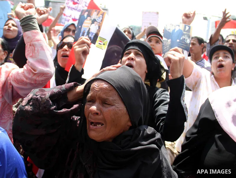 Egyptians take part in a rally after prayer at Tahrir Square in Cairo, Egypt, on July 1, 2011. Hundreds of people were rallying in the square, that was the epicenter of the uprising that toppled Hosni Mubarak, demanding...