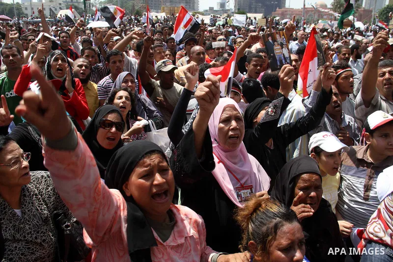 Egyptians take part in a rally after prayer at Tahrir Square in Cairo, Egypt, on July 1, 2011. Hundreds of people were rallying in the square, that was the epicenter of the uprising that toppled Hosni Mubarak, demanding...