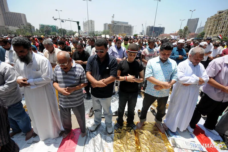 Egyptians attend Friday prayers at Tahrir Square in Cairo, Egypt, on July 1, 2011. Hundreds of people were rallying in the square, that was the epicenter of the uprising that toppled Hosni Mubarak, demanding speedy trial...