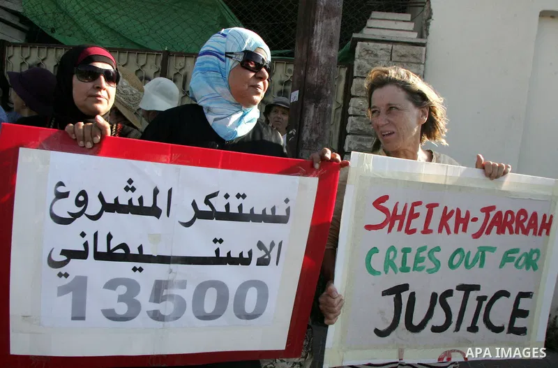 Israeli, Palestinian and foreign activists take part in a weekly demonstration against Israel's occupation of Palestinian land on July 1, 2011 in the mostly Arab Jerusalem neighborhood of Sheikh Jarrah. Photo by Mahfouz...