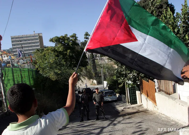 Israeli, Palestinian and foreign activists take part in a weekly demonstration against Israel's occupation of Palestinian land on July 1, 2011 in the mostly Arab Jerusalem neighborhood of Sheikh Jarrah. Photo by Mahfouz...