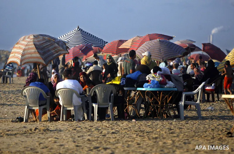 Palestinians enjoy swimming in the sea on Gaza's beach on July 1, 2011 in Gaza City. Photo by Ali Jadallah