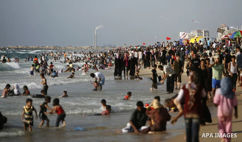 Palestinians enjoy swimming in the sea on Gaza's beach on July 1, 2011 in Gaza City. Photo by Ali Jadallah