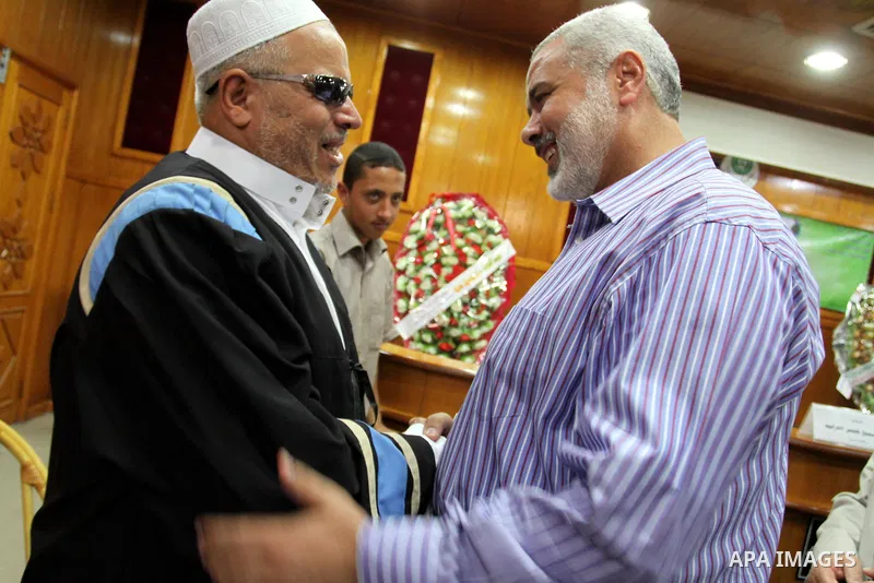 Palestinian Prime Minister in Gaza strip, Ismail Haniya attends the discussion of the Master of blind students at the Islamic University in Gaza city on July 2, 2011. Photo by Mohammed Asad
