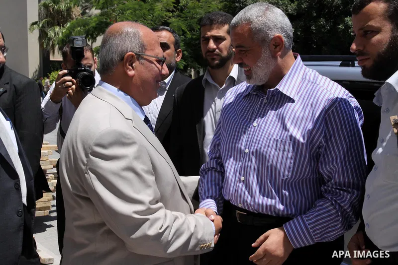 Palestinian Prime Minister in Gaza strip, Ismail Haniya shake hands with the deputy in the Palestinian Legislative Council, Gamal Al-Khoudari in Gaza city on July 2, 2011. Palestinian Prime Minister in Gaza strip said in...
