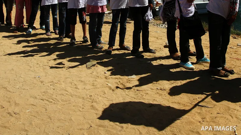 Palestinian children wave Palestinian flags along with the national flags of activists taking part in the Gaza-bound international Freedom Flotilla hoping to breach Israel's sea blockade on Gaza during a rally in Gaza Ci...