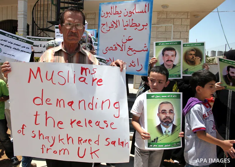 Supporters of Sheikh Raed Salah, head of the radical wing of the Islamic Movement in Israel, demonstrate outside the Red Cross office in the West Bank city of Hebron, on July 03 ,2011 after the controversial Arab-Israeli...