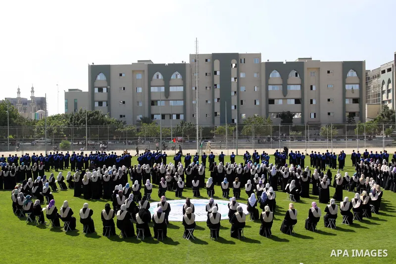 Palestinian students are seen during their training in preparation for graduation ceremony that starting tomorrow in the Islamic University in Gaza city on July 3, 2011. Photo by Mohammed Asad
