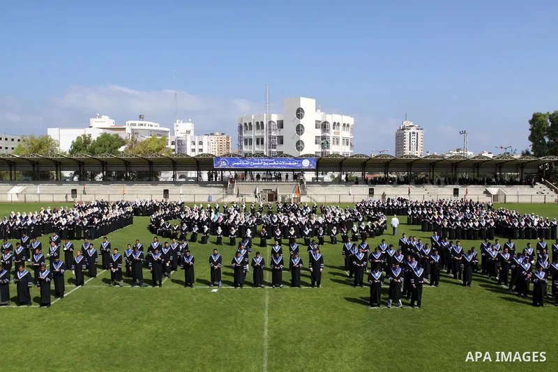 Palestinian students are seen during their training in preparation for graduation ceremony that starting tomorrow in the Islamic University in Gaza city on July 3, 2011. Photo by Mohammed Asad