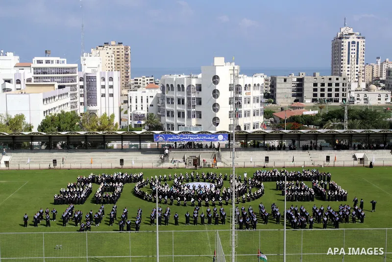 Palestinian students are seen during their training in preparation for graduation ceremony that starting tomorrow in the Islamic University in Gaza city on July 3, 2011. Photo by Mohammed Asad
