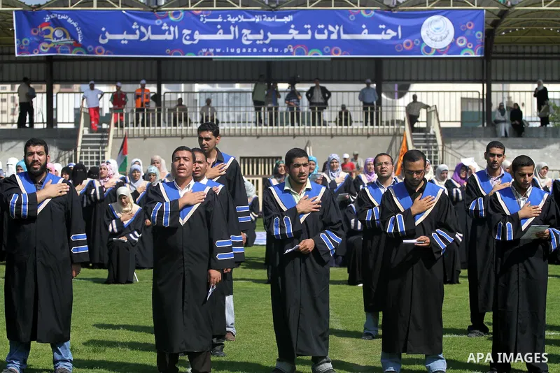 Palestinian students are seen during their training in preparation for graduation ceremony that starting tomorrow in the Islamic University in Gaza city on July 3, 2011. Photo by Mohammed Asad