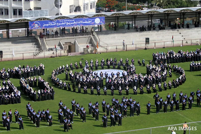 Palestinian students are seen during their training in preparation for graduation ceremony that starting tomorrow in the Islamic University in Gaza city on July 3, 2011. Photo by Mohammed Asad