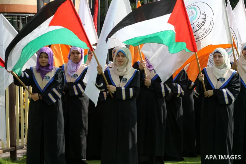 Palestinian students are seen during their training in preparation for graduation ceremony that starting tomorrow in the Islamic University in Gaza city on July 3, 2011. Photo by Mohammed Asad
