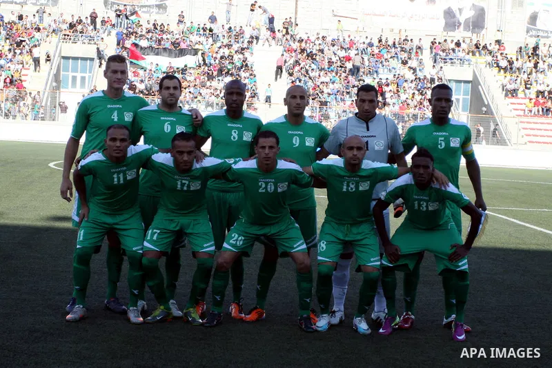 Palestinian players pose for pictures during a soccer match between the Palestinian and Afghanistan national teams in the West bank city of Ramallah, Sunday July 3, 2011. The Palestinian national soccer team drew 1-1 aga...