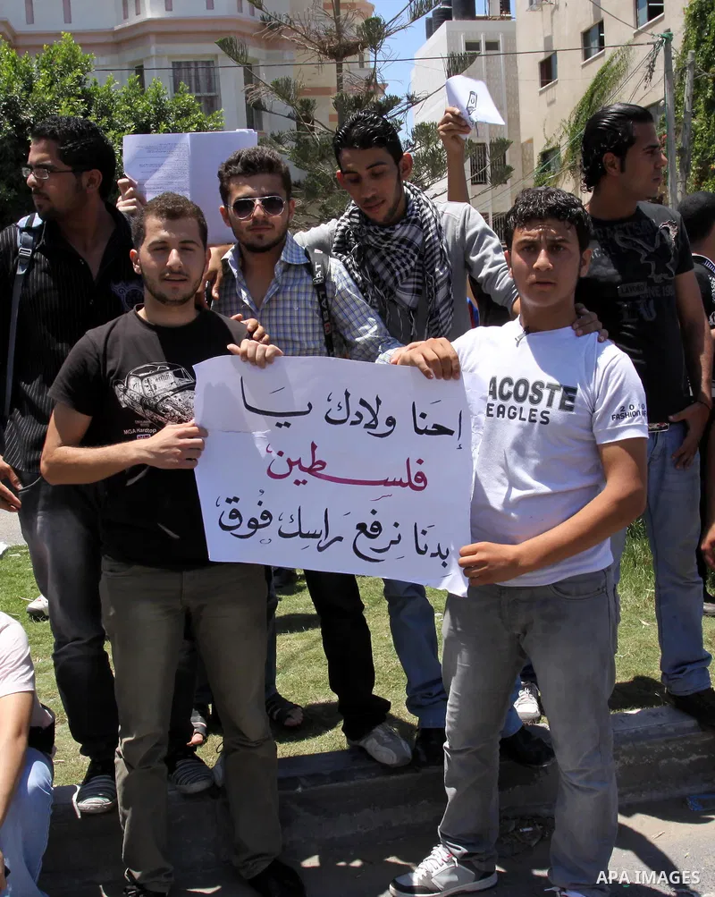 Palestinian students take a part in a protest in front of the headquarters of the Ministry of Education after the end of exams and they object to the difficulty of the exams in Gaza city on July 4, 2011. Photo by Mohamme...