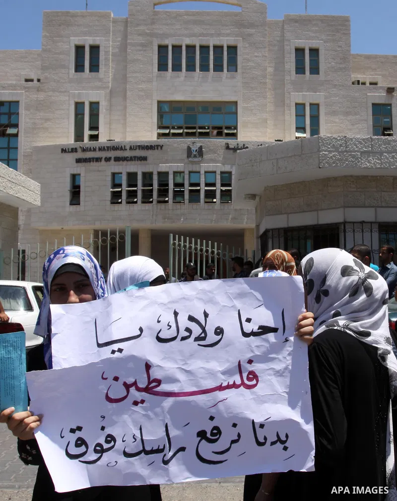 Palestinian students take a part in a protest in front of the headquarters of the Ministry of Education after the end of exams and they object to the difficulty of the exams in Gaza city on July 4, 2011. Photo by Mohamme...
