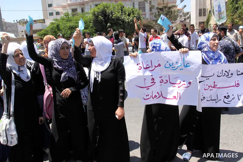 Palestinian students take a part in a protest in front of the headquarters of the Ministry of Education after the end of exams and they object to the difficulty of the exams in Gaza city on July 4, 2011. Photo by Mohamme...