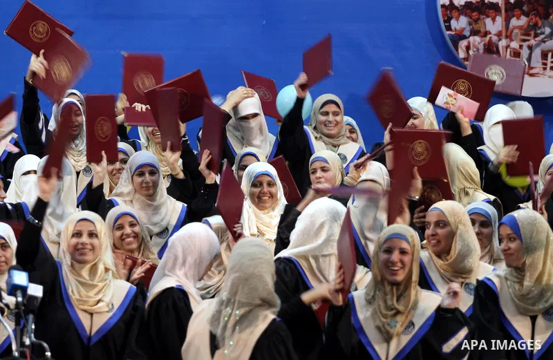 Palestinian students participate in their graduation ceremony at the Islamic University in Gaza city on July 4,2011. Photo by Mohammed Asad