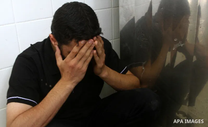 A Palestinian reacts after two men were killed by Israeli forces, at the morgue of Al-Aqsa hospital in Deir Al Balah, central Gaza Strip, Tuesday, July 5, 2011. An Israeli attack struck a target along the Gaza Strip's bo...