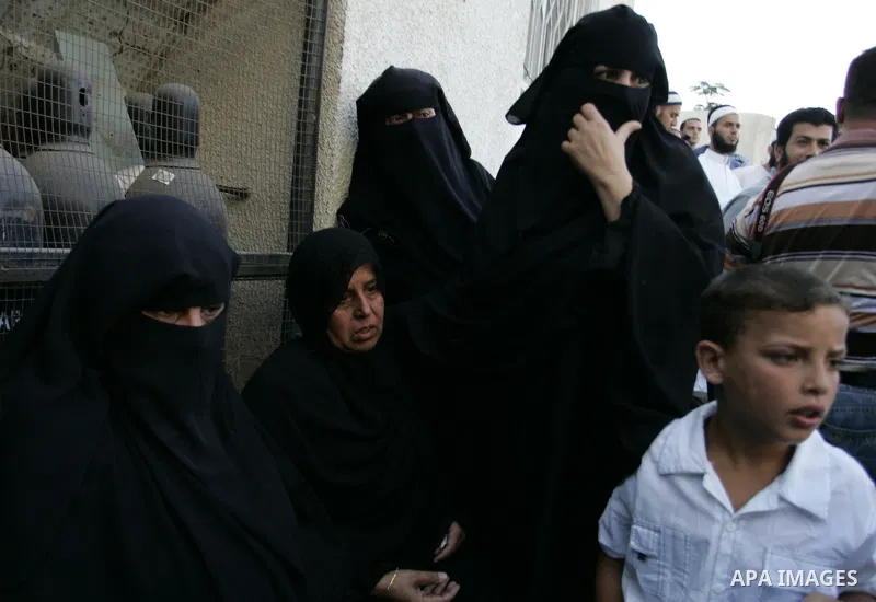 Relatives of two Palestinians killed by Israeli forces react as they arrive at the morgue of Al-Najjar hospital in Rafah, southern Gaza Strip, Tuesday, July 5, 2011. An Israeli attack struck a target along the Gaza Strip...