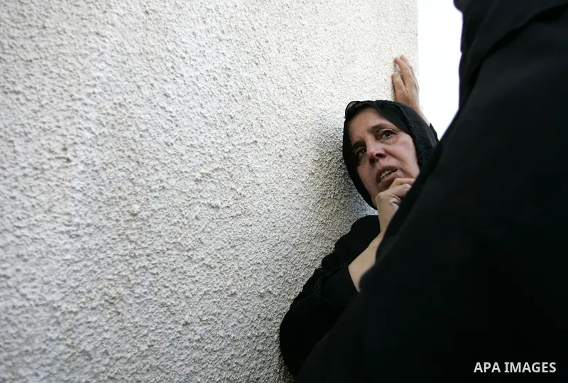 Relatives of two Palestinians killed by Israeli forces react as they arrive at the morgue of Al-Najjar hospital in Rafah, southern Gaza Strip, Tuesday, July 5, 2011. An Israeli attack struck a target along the Gaza Strip...