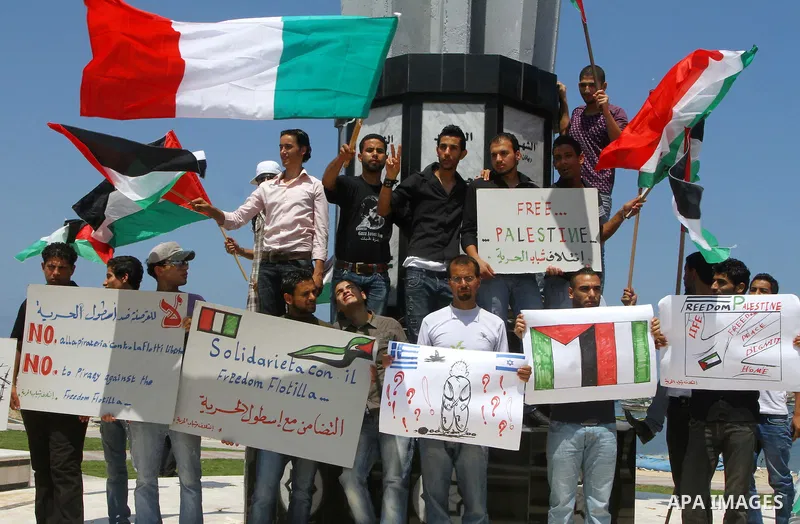 Palestinians take part in a rally to show solidarity with the "Freedom Flotilla II" at Gaza seaport July 6, 2011. Pro-Palestinian activists hoping to sail to Gaza this week fully expected their flotilla to be blocked by...