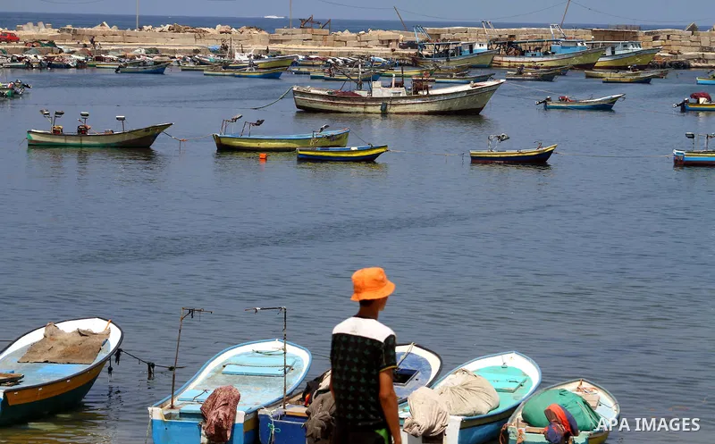 A Palestinian boy stands along the dock in the port at Gaza City on July 6, 2011. Pro-Palestinian activists hoping to sail to Gaza this week fully expected their flotilla to be blocked by Israeli marines. Photo by Ashraf...