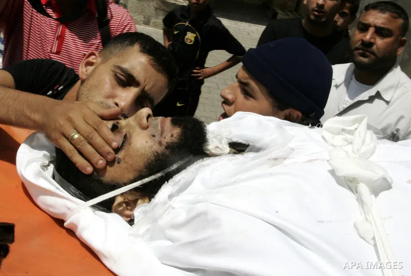 Palestinian relatives carry the body of Kamal Hamdan Muammar, 28-years-old, for burial following prayers at the mosque in the Rafah refugee camp, in the southern of Gaza Strip, on July 6, 2011, after being killed along w...