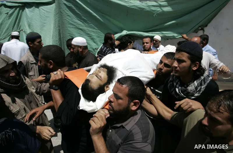 Palestinian relatives carry the body of Mohammed Said Abu Jazar, 28-years-old, for burial following prayers at the mosque in the Rafah refugee camp, in the southern of Gaza Strip, on July 6, 2011, after being killed alon...