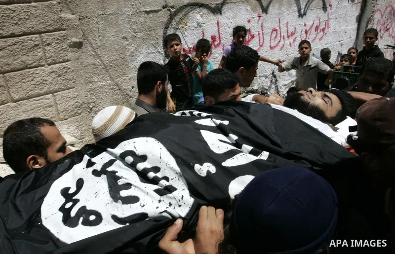 Palestinian relatives carry the body of Mohammed Said Abu Jazar, 28-years-old, for burial following prayers at the mosque in the Rafah refugee camp, in the southern of Gaza Strip, on July 6, 2011, after being killed alon...
