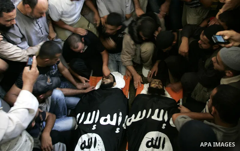 Palestinian relatives and friends of Kamal Hamdan Muammar and Mohammed Said Abu Jazar, both 28-years-old, ready to bury them following prayers at the mosque in the Rafah refugee camp, in the southern of Gaza Strip, on Ju...