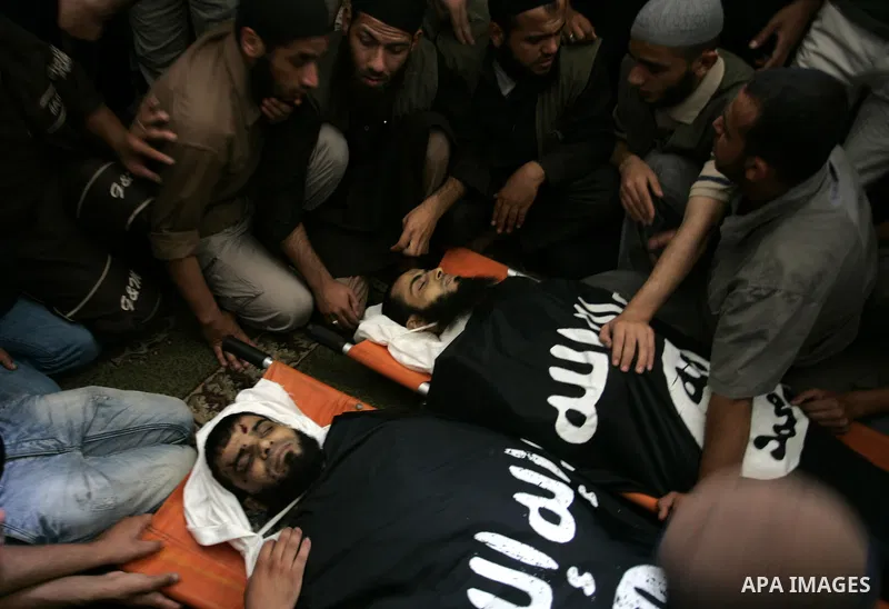 Palestinian relatives and friends of Kamal Hamdan Muammar and Mohammed Said Abu Jazar, both 28-years-old, ready to bury them following prayers at the mosque in the Rafah refugee camp, in the southern of Gaza Strip, on Ju...