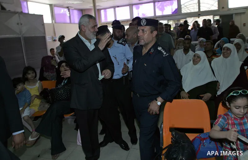 Palestinian Prime Minister in Gaza Strip, Ismail Haniya visits the travellers leaving the Gaza Strip through the Rafah crossing into Egypt during his visit to the Rafah border crossing in the southern Gaza Strip on July...