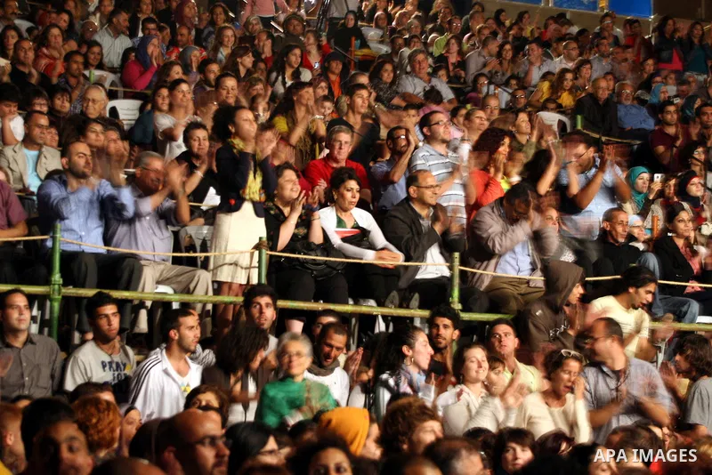Palestinians attend a concert for Jordanian singer, Makadi Nahas performs at the Palestine International Festival in the West Bank city of Ramallah on July 6, 2011. Photo by Issam Rimawi