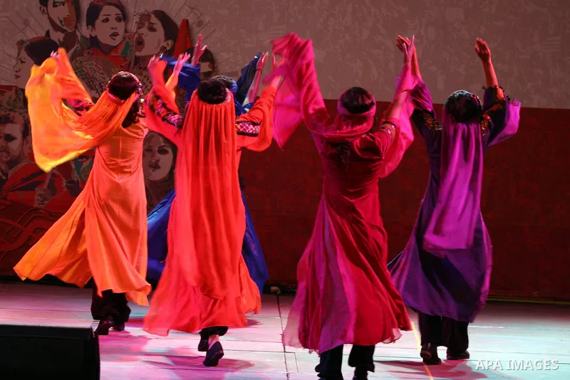 Dancers of the El-Funoun Palestinian Popular Dance Troupe perform on the third day of the 13th Palestine International Festival in the West Bank city of Ramallah on July 6, 2011. The festival, which features music and da...