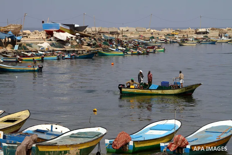 Palestinian fishermen ride their boats at Gaza seaport on July 7, 2011. Pro-Palestinian activists hoping to sail to Gaza this week fully expected their flotilla to be blocked by Israeli marines. Photo by Mohammed Asad