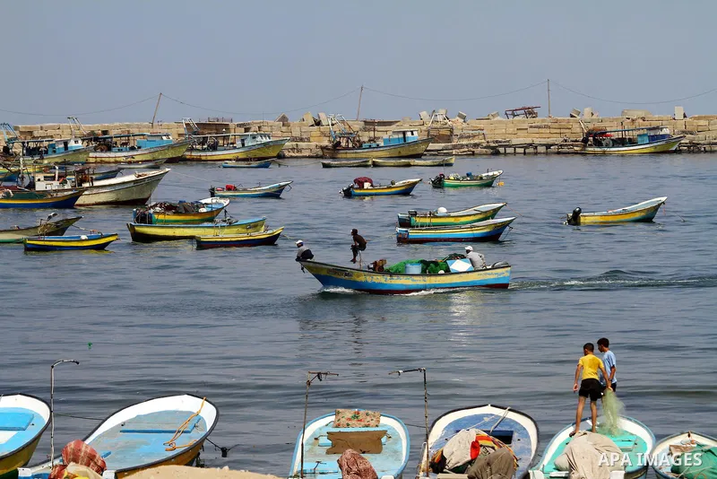 Palestinian fishermen ride their boats at Gaza seaport on July 7, 2011. Pro-Palestinian activists hoping to sail to Gaza this week fully expected their flotilla to be blocked by Israeli marines. Photo by Mohammed Asad