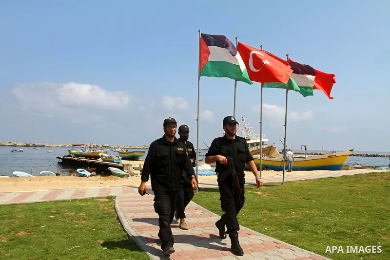 Palestinian Hamas officers walk at Gaza seaport on July 7, 2011. Pro-Palestinian activists hoping to sail to Gaza this week fully expected their flotilla to be blocked by Israeli marines. Photo by Mohammed Asad
