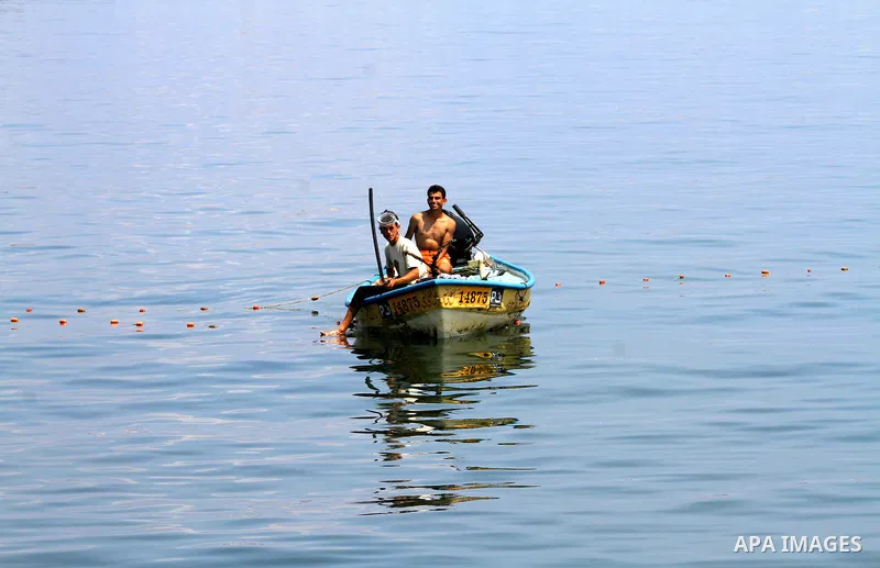 Palestinian fishermen ride their boats at Gaza seaport on July 7, 2011. Pro-Palestinian activists hoping to sail to Gaza this week fully expected their flotilla to be blocked by Israeli marines. Photo by Mohammed Asad