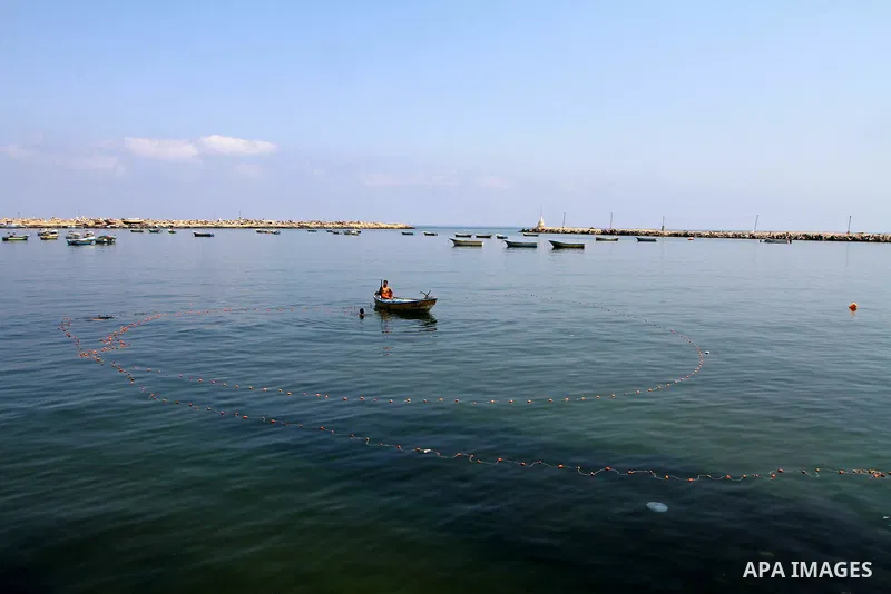 Palestinian fishermen ride their boats at Gaza seaport on July 7, 2011. Pro-Palestinian activists hoping to sail to Gaza this week fully expected their flotilla to be blocked by Israeli marines. Photo by Mohammed Asad