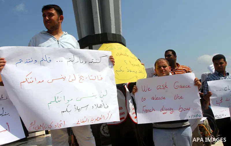 Palestinians take part in a rally to show solidarity with the "Freedom Flotilla II" at Gaza seaport on July 7, 2011. Pro-Palestinian activists hoping to sail to Gaza this week fully expected their flotilla to be blocked...