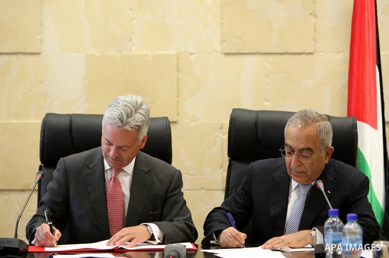 Palestinian Prime Minister, Salam Fayyad during the signing agreement ceremony with Alan Duncan, Minister of State for International Development in the West Bank city of Ramallah on July 7, 2011. Photo by Mustafa Abu Day...