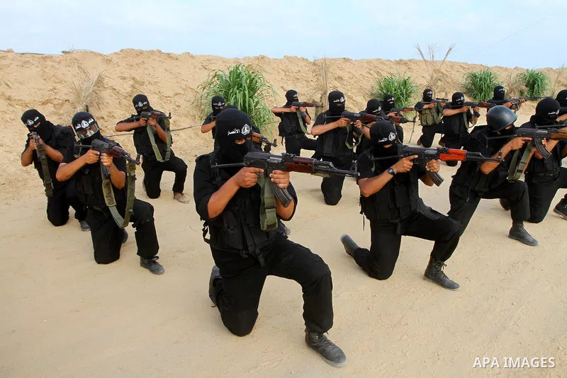 Palestinian militants from Al-Ansar brigades, the armed wing of Al-Ahrar movement, demonstrate their skills during a drill in front of the media in Khan Younis in the southern Gaza Strip July 7, 2011. Photo by Ashraf Amr...