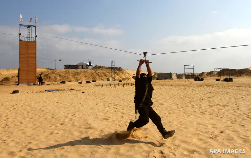 Palestinian militants from Al-Ansar brigades, the armed wing of Al-Ahrar movement, demonstrate their skills during a drill in front of the media in Khan Younis in the southern Gaza Strip July 7, 2011. Photo by Ashraf Amr...