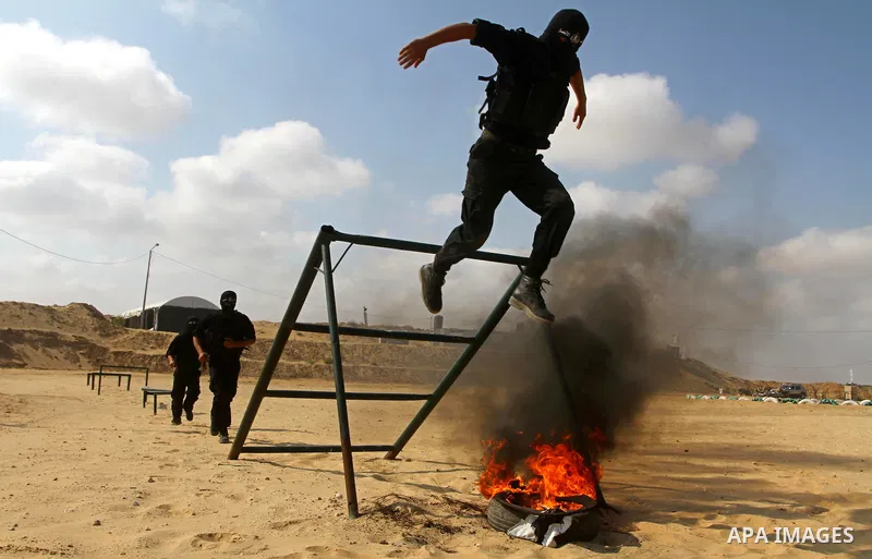 Palestinian militants from Al-Ansar brigades, the armed wing of Al-Ahrar movement, demonstrate their skills during a drill in front of the media in Khan Younis in the southern Gaza Strip July 7, 2011. Photo by Ashraf Amr...