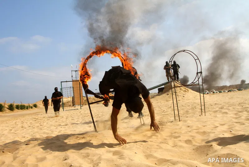 Palestinian militants from Al-Ansar brigades, the armed wing of Al-Ahrar movement, demonstrate their skills during a drill in front of the media in Khan Younis in the southern Gaza Strip July 7, 2011. Photo by Ashraf Amr...